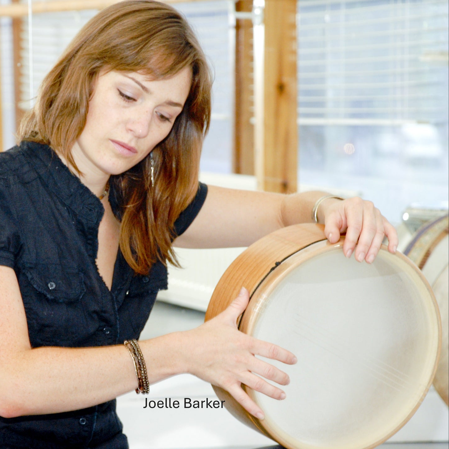 Joelle Barker with lap style frame drum