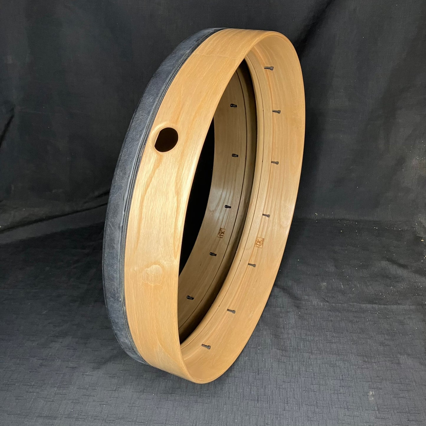 Substitute a REMO Ebony drum head for a REMO Renaissance drum head